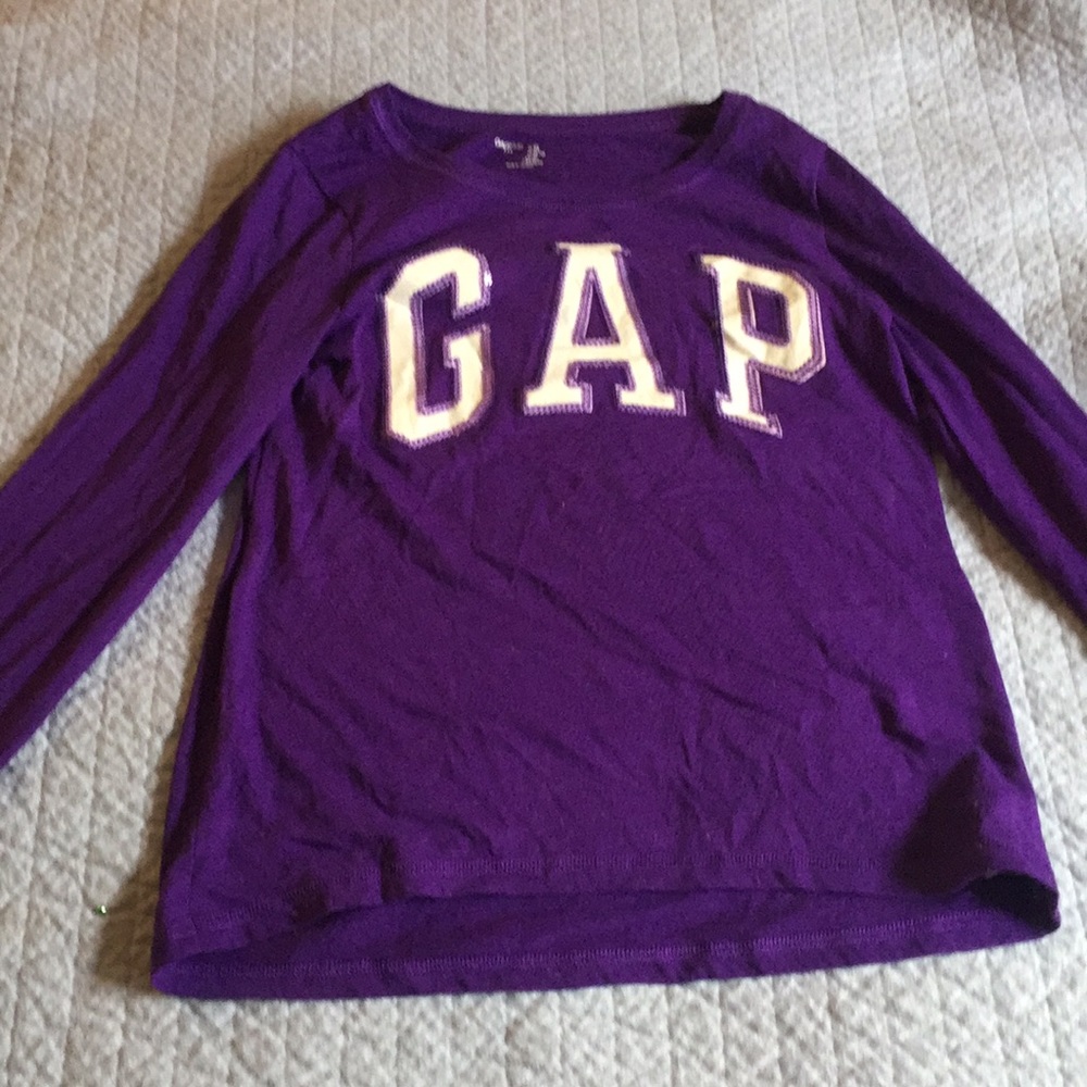 A long-sleeved purple shirt with GAP in the front.